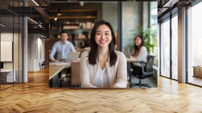 Happy Asian businesswoman and marketing team in office. CEO, colleague and teamwork concept Wall mural