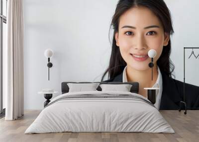 Portrait of smiling smart Asian businesswoman standing over white background. Studio shot, Copy space Wall mural