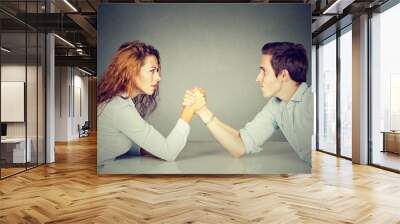 Business people woman and man arm wrestling Wall mural