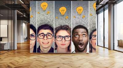 Group of people men and women with many ideas light bulbs above head looking up. Wall mural