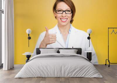 healthcare professional with glasses giving thumbs up Wall mural