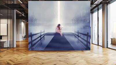 Lonely woman sitting on pier bright glowing light in hand Wall mural