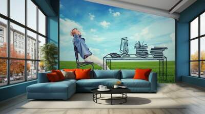 man relaxing at his desk outdoors Wall mural