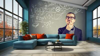 Portrait happy man thinking dreaming has many ideas looking up isolated gray background. Positive emotion feeling life perception. Decision making process Wall mural