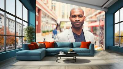 portrait of young man smiling isolated on outside Wall mural