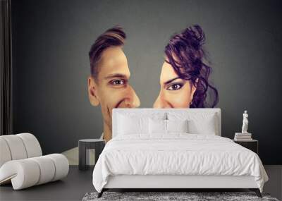 surrealistic portrait front with cut out profile of a happy young man and woman Wall mural