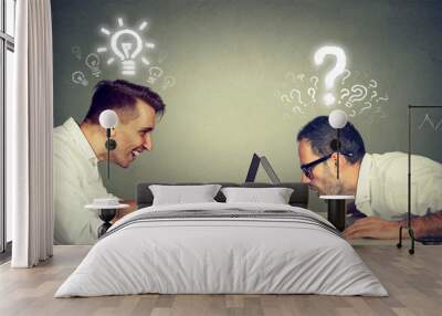 two men using laptop computer one educated has bright ideas the other ignorant has questions Wall mural