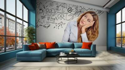 woman sitting at table has many ideas planning future Wall mural