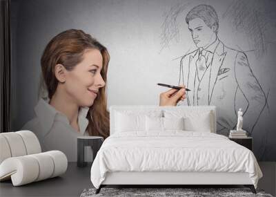 woman stylist drawing with pen male model in full suit Wall mural