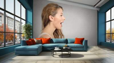 woman talking with sound coming out of her open mouth Wall mural