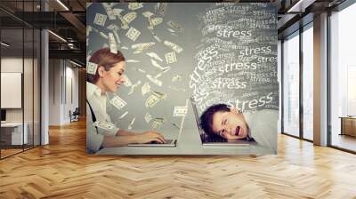 Woman under cash rain working on laptop next to stressed man Wall mural