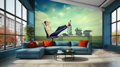 young businesswoman relaxing sitting in the office Wall mural