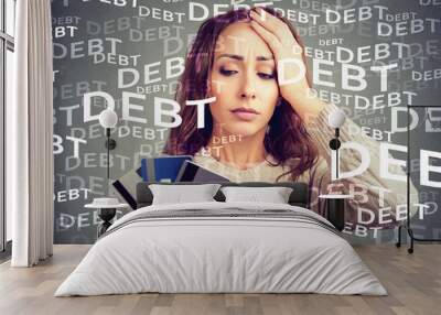 Young woman with credit card debt Wall mural