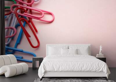 multicolored paper clips on a pink background. The concept is time to school. Wall mural