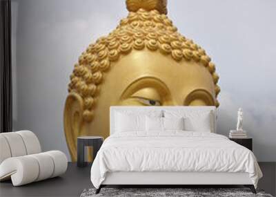 The golden statue of the buddha statue in the sky background Wall mural