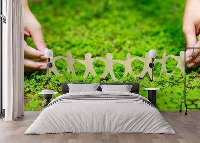 Human Chain on Green Plant Wall mural