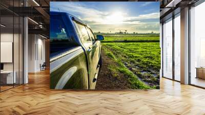 Pickup Truck in the Field at Sunset Wall mural