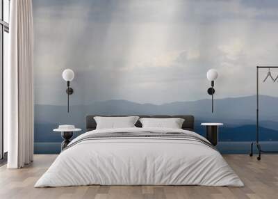 storm clouds and rain over flathead lake in montana Wall mural