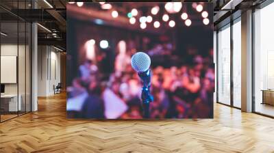 Event hall: Close up of microphone stand, seats with audience in the blurry background Wall mural