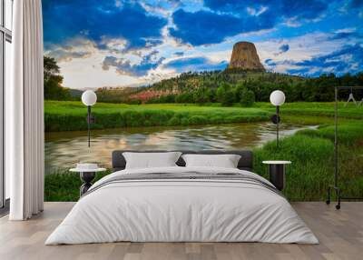 Sunset at Devils Tower National Monument with the Belle Fourche River in the foreground. Wall mural