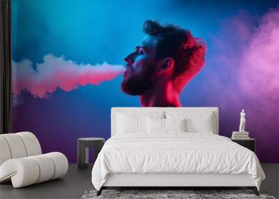 Man exhaling colorful vape smoke, neon-lit profile portrait, vibrant blue and pink vapor clouds, urban vaping lifestyle scene, modern e-cigarette subculture Wall mural