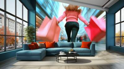 Woman running with pink shopping bags, motion blur background, Black Friday shopping frenzy concept Wall mural