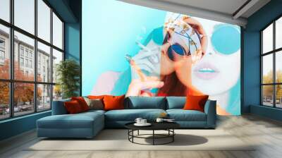 Double exposure of hippy girl smoking weed while wearing sunglasses Wall mural