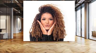 Lovely woman with gorgeous curly hair giving a kiss Wall mural