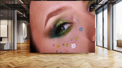 Spring beauty trendy makeup with vibrant green inspired by nature's blooms, perfect for a fresh approach to glamour. Spring makeup. Floral makeup. Eye makeup Wall mural