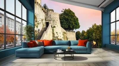 Wall in San Marino, Europe. Beautiful sunset and colorful sky. Fall is coming.   Wall mural