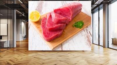 Raw tuna steak on wooden cutboard Wall mural