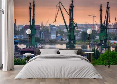 Shipyard cranes in Gdansk at sunset. Poland Wall mural