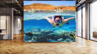 Young woman at snorkeling in the tropical water Wall mural