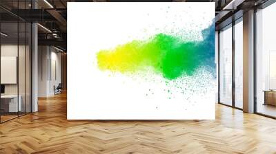 Colorful powder explosion on white background.Abstract blue yellow green  color dust particles splash. Wall mural