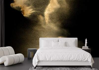 Sand explosion isolated on black background. Freeze motion of sandy dust splash. Wall mural