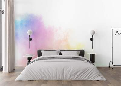 The explosion of multi colored powder. Beautiful rainbow color powder fly away. The cloud of glowing color powder on white background Wall mural