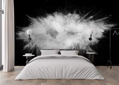 White powder explosion isolated on black background. White dust particles splash.Color Holi Festival. Wall mural