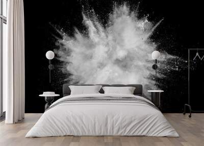 White powder explosion isolated on black background. White dust particles splash.Color Holi Festival. Wall mural