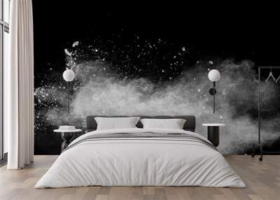 White powder explosion isolated on black background.White dust particles splash. Wall mural