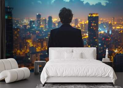 A corporate executive gazes at the city skyline, dreaming of new business ventures and future success. Copy space Wall mural