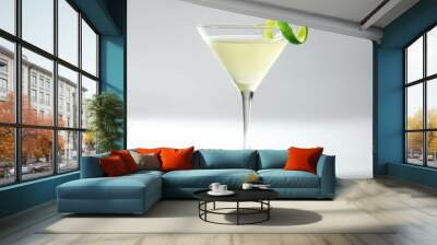 A daiquiri in a coupe glass with a lime wedge on a white background Wall mural