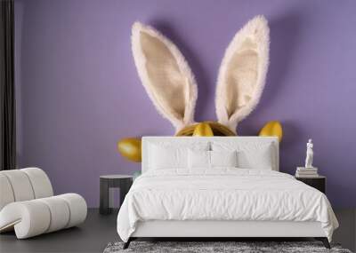 easter concept top view photo of fluffy bunny ears and colorful easter eggs on isolated lilac backgr Wall mural