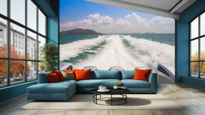 Speed boat engine driving along waving water  Wall mural