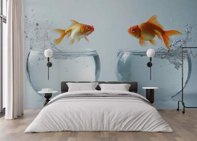 A vibrant goldfish leaping out of a glass bowl, mid-air with water splashing around Wall mural