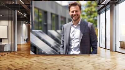 businessman smiling and standing with solar cells, solar cells business concept Wall mural