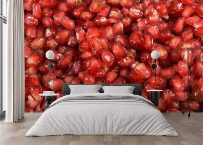 pomegranate seeds on black slate background Wall mural