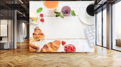 breakfast time with croissants and coffee at workplace Wall mural