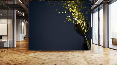 gold winning cup on dark blue background , success concept Wall mural