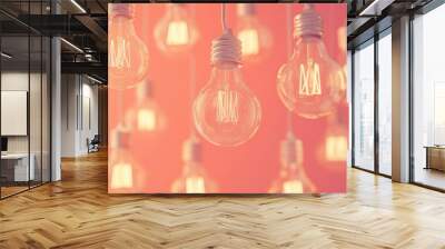 Glowing Light Bulbs against a Coral Background Wall mural