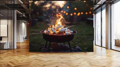 A backyard gathering featuring a fire pit, marshmallows roasting on sticks, with the warm light contrasting against the cool evening air, grill smoke wafting gently Wall mural